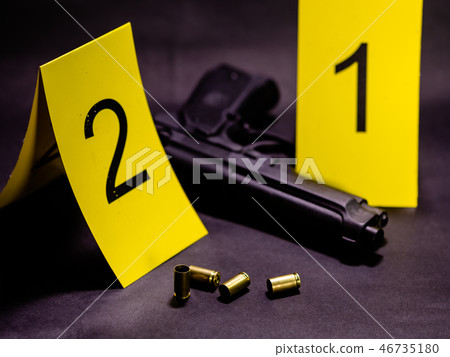 Bullets and gun at crime scene 46735180