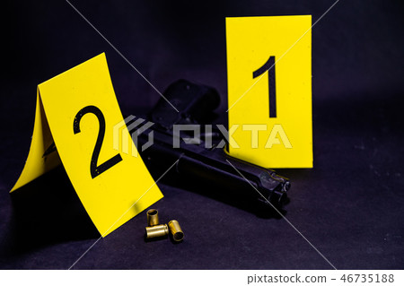 Bullets and gun at crime scene Bullets and gun at crime scene 46735188