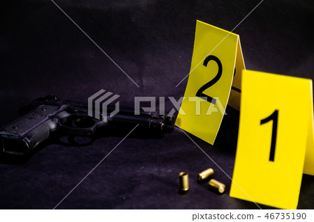 Bullets and gun at crime scene Bullets and gun at crime scene 46735190