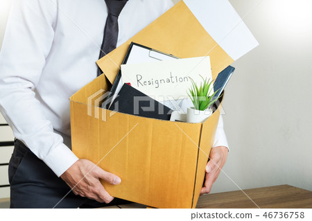 Businessmen are holding resignation document and packing persona 46736758