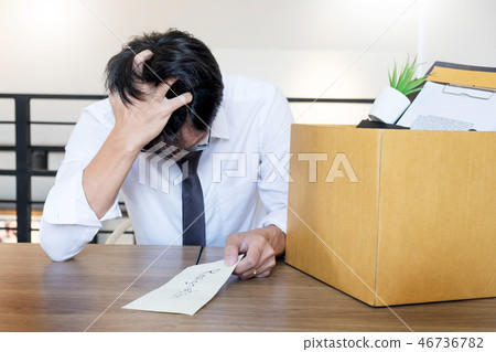Businessmen are holding resignation document and packing persona 46736782
