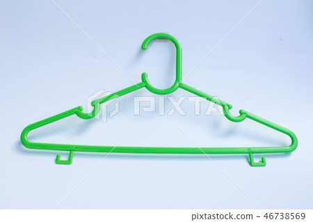 green plastic hanger on white background green plastic hanger on white background 46738569