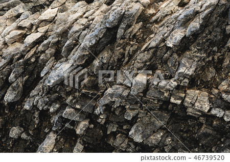 Textured basalt background thin stone fibers in the cut. natural volcanic formations 46739520