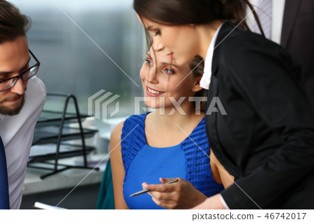 Group of modern businesspeople in office Group of modern businesspeople in office 46742017