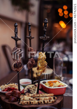 Meat on skewer fry with a cooking gas torch flomber. Meat on skewer fry with a cooking gas torch flomber. 46742021