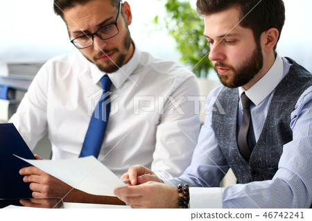 Group of people hold in arms financial papers solve and discuss problem 46742241