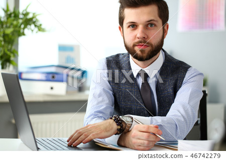 Handsome smiling bearded clerk man at office workplace 46742279