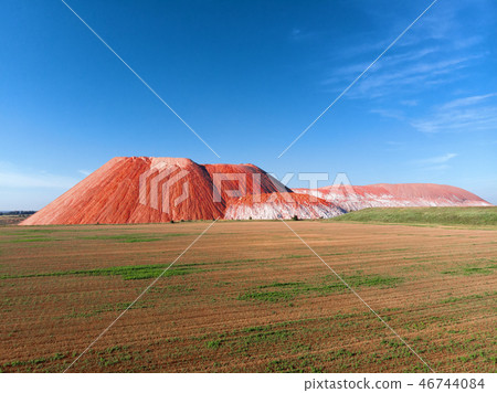 Summer landscape Red mountain blue sky green field 46744084