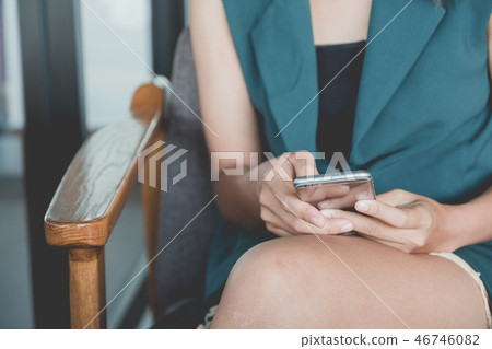 Woman hands working and using smart phone Woman hands working and using smart phone 46746082