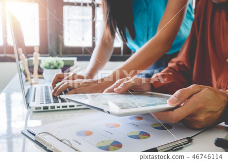 Business project team working and discussing data Business project team working and discussing data 46746114
