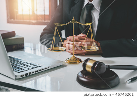 Male lawyer in the office with brass scale 46746201