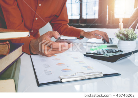 Business man working with smart phone and laptop Business man working with smart phone and laptop 46746202