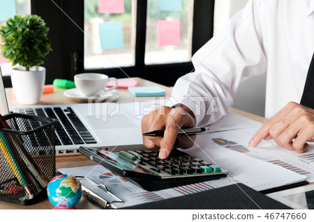 Businessman hand working with financial data  46747660