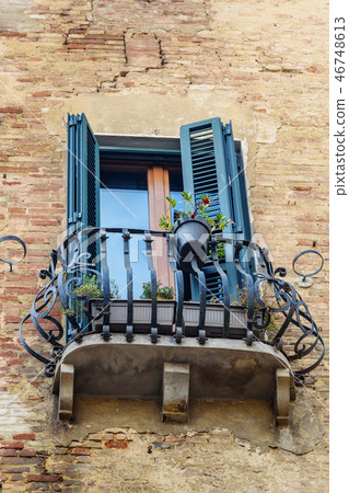 Window and balcony with wooden shutters Window and balcony with wooden shutters 46748613