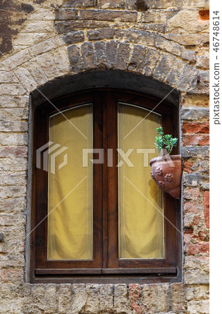 Window with of old house in Siena. Italy Window with of old house in Siena. Italy 46748614