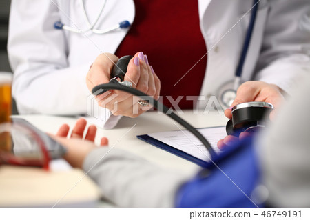 Female doctor arms make medic procedure closeup Female doctor arms make medic procedure closeup 46749191
