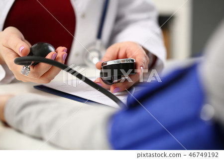 Female doctor arms make medic procedure closeup Female doctor arms make medic procedure closeup 46749192