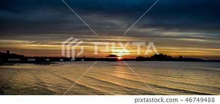 Sunset sky at sea with silhouette of bridge and is Sunset sky at sea with silhouette of bridge and is 46749488