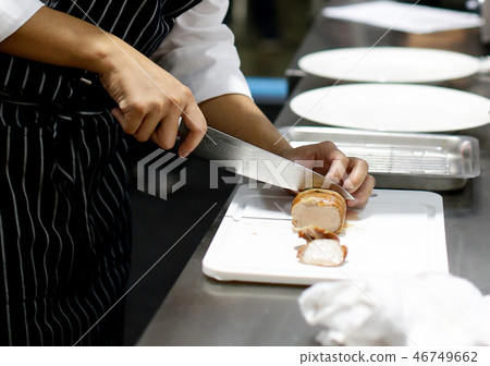 Chef cooking food in the kitchen, preparing food 46749662