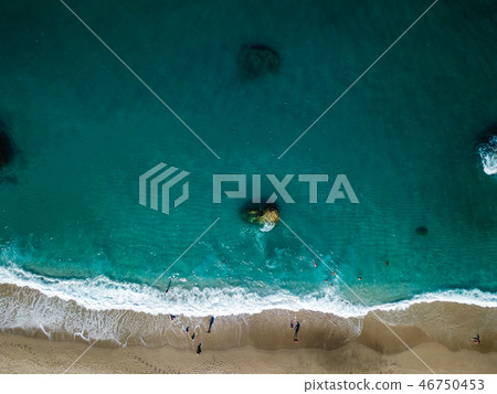 Aerial View From Flying Drone Of People Relaxing Aerial View From Flying Drone Of People Relaxing 46750453