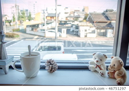 Coffee cup and couple bear sit on wooden bar 46751297