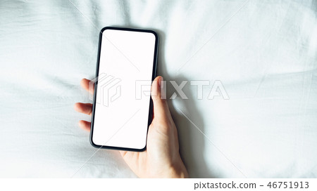 hand using blank screen of smartphone on room. 46751913