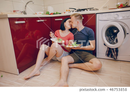 couple in a kitchen couple in a kitchen 46753858