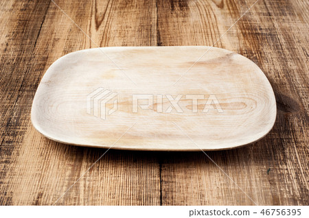 Blank wood plate on wooden rustic table. Blank wood plate on wooden rustic table. 46756395