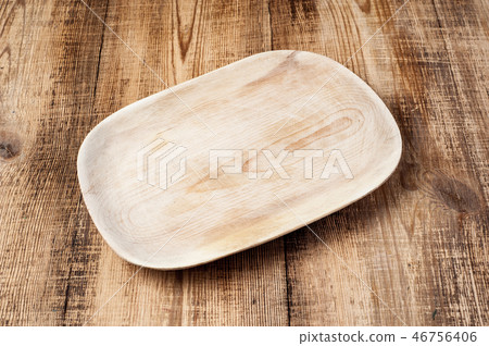 Blank wood plate on wooden rustic table. Blank wood plate on wooden rustic table. 46756406