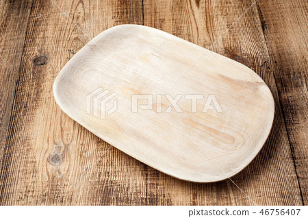 Blank wood plate on wooden rustic table. Blank wood plate on wooden rustic table. 46756407