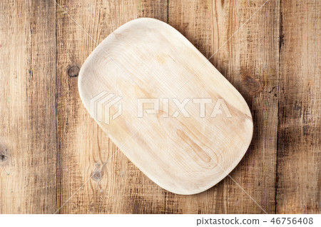 Blank wood plate on wooden rustic table. Blank wood plate on wooden rustic table. 46756408