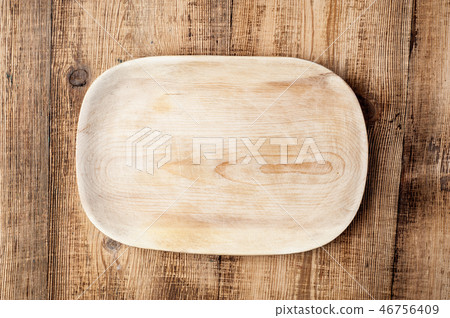 Blank wood plate on wooden rustic table. Blank wood plate on wooden rustic table. 46756409