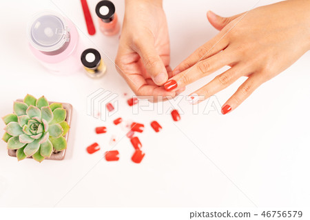 women manicure and attach a nail shape with gel 46756579
