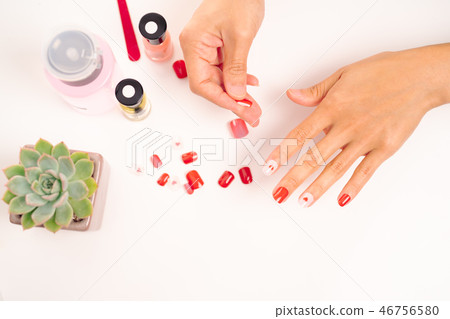 women manicure and attach a nail shape with gel 46756580