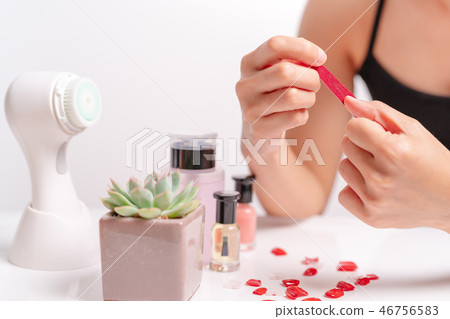 women manicure and attach a nail shape with gel women manicure and attach a nail shape with gel 46756583
