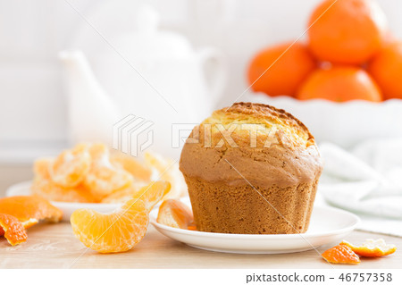 Muffin with tangerines closeup on white 46757358