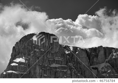 Top of mountain with snow and sky with clouds Top of mountain with snow and sky with clouds 46758784