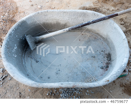 Large plastic bucket for mixing the cement mortar. Large plastic bucket for mixing the cement mortar. 46759677