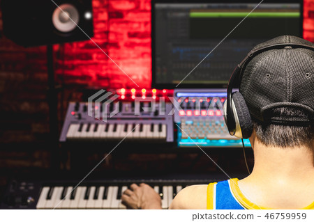 back of male asian music producer arranging music back of male asian music producer arranging music 46759959