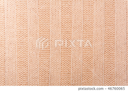 surface of a wool knitted fabric close up 46760065
