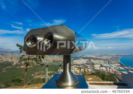 Closeup view of coin operated binocular viewer for looking Closeup view of coin operated binocular viewer for looking 46760594