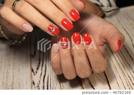 Amazing natural nails. Women's hands with clean manicure. Gel polish applied. Amazing natural nails. Women's hands with clean manicure. Gel polish applied. 46762169