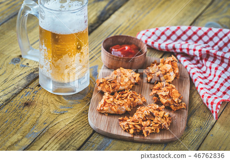 Barbecue chicken bites with mug of beer 46762836
