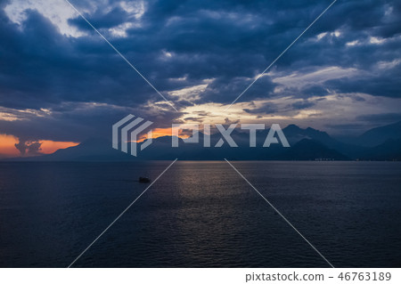 Tourists travelling by small ship in scenic marine background. Tourists travelling by small ship in scenic marine background. 46763189