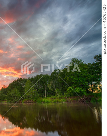 Sunset long the banks of the Amazon river.  46763429