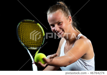 Young woman on a tennis practice. Beginner player holding a racket, learning basic skills. Portrait 46764274