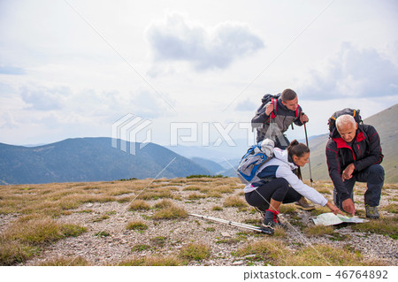 adventure, travel, tourism, hike and people concept - group of smiling friends with backpacks and 46764892