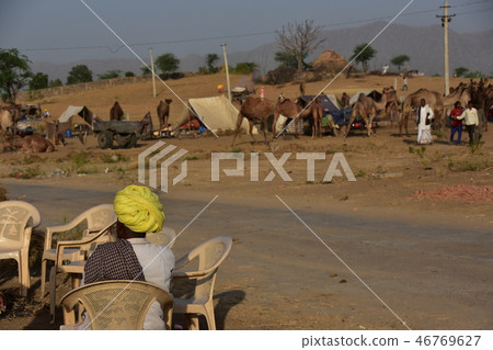 Indians resting in a canteen in the canteen collecting in the desert during the Pushkar camel festival in Rajasthan, India 46769627