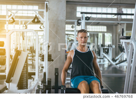 Fitness sport man doing exercises training Fitness sport man doing exercises training 46769768