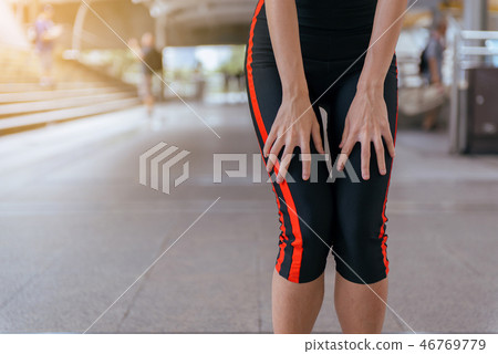 Woman suffering from pain in leg injury after spor 46769779